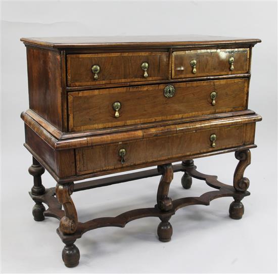 A William & Mary crossbanded walnut chest on stand, W.3ft 4in., adapted